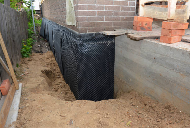 SJ Waterproofing Pros technician performing targeted Waterproofing assessment in Plainfield, IL